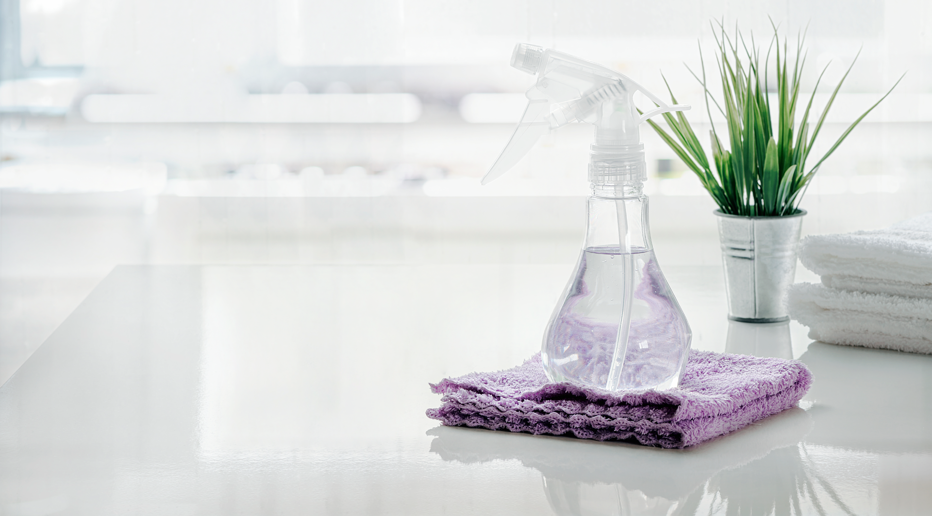vecteezy_spray-bottle-and-towel-on-white-table-in-kitchen_1309416
